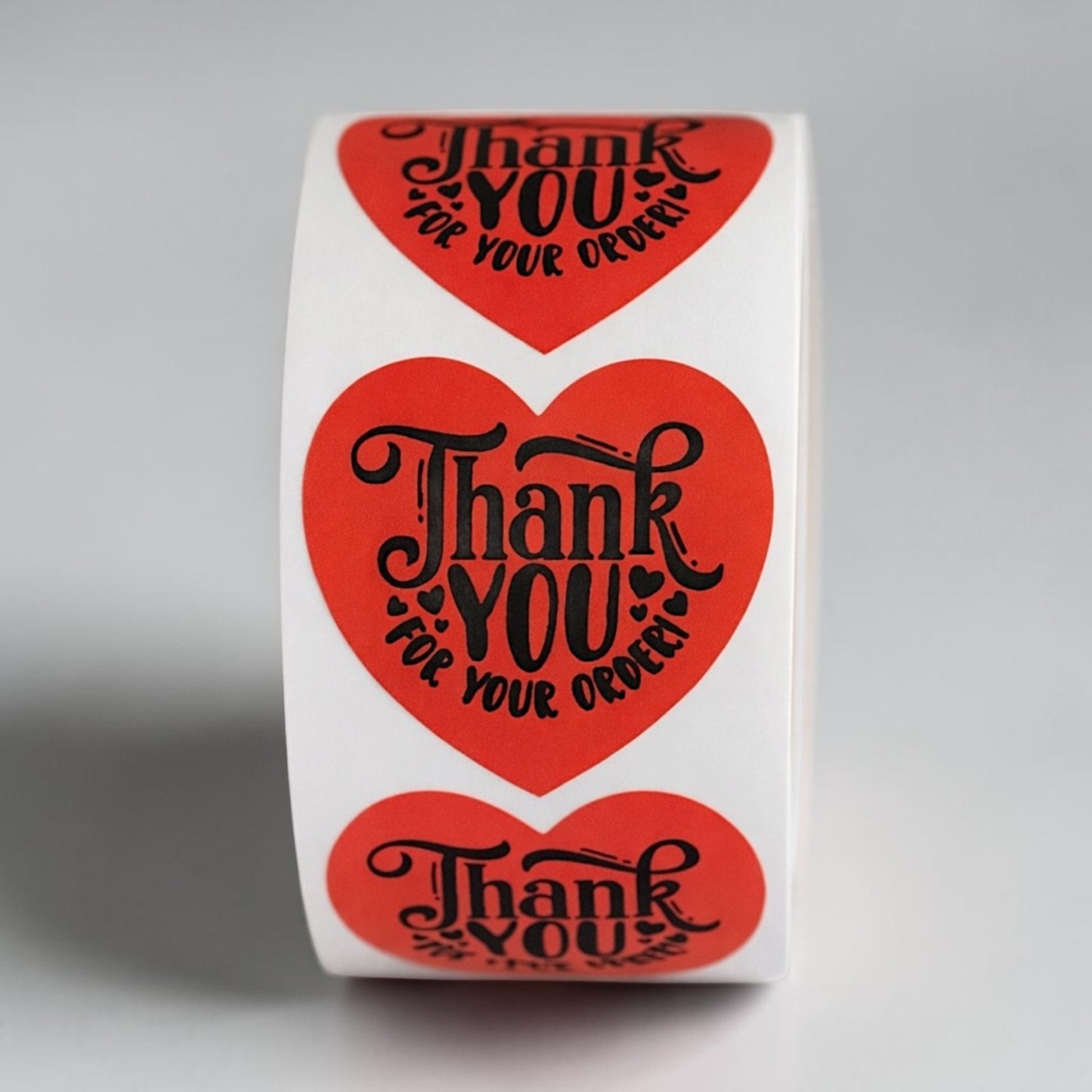 Thank You For Your Order heart sticker roll on white background